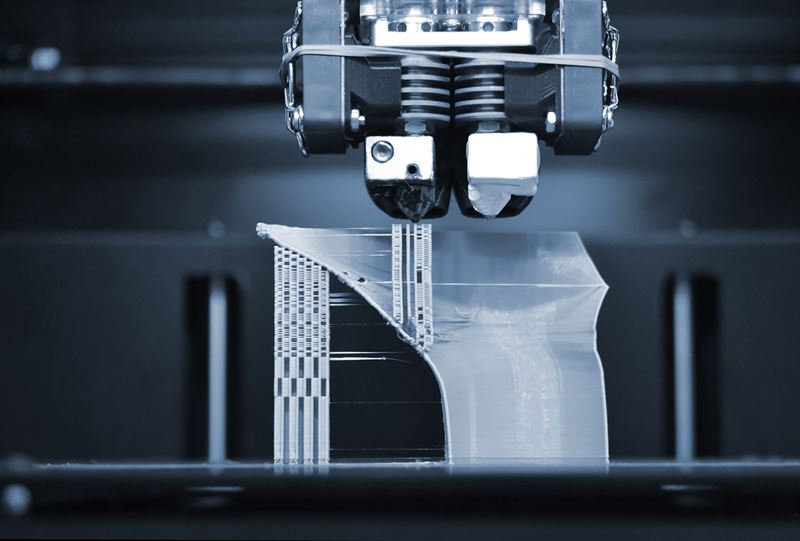 An extreme close-up of a 3D printing machine
